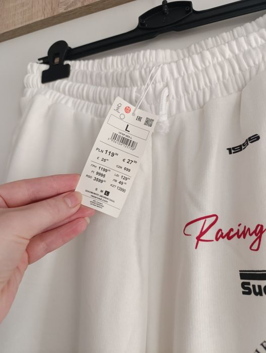 Reserved rozmiar 40 L białe spodnie dresowe z szerokimi nogawkami