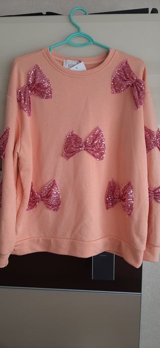 Bluza z cekinowymi kokardami rozm. Xxl