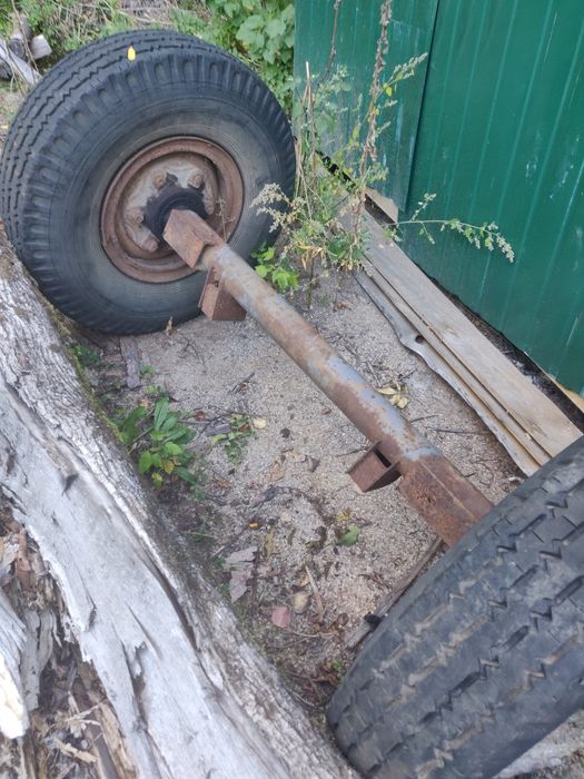 Ось для прицепа с колёсами