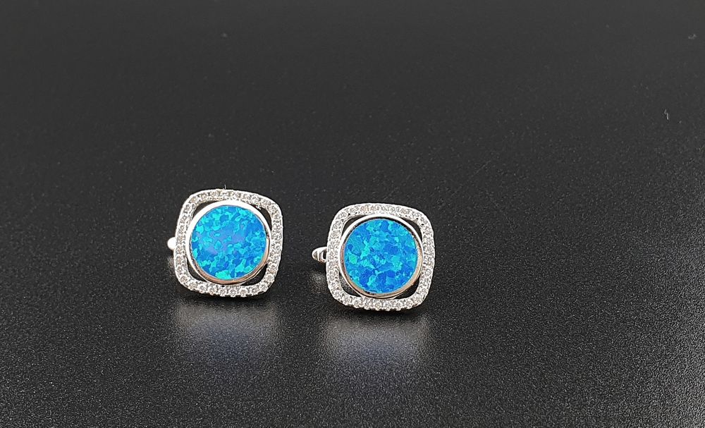 Okazałe kolczyki srebrne p.925 z niebieskim opalem i cyrkoniami
