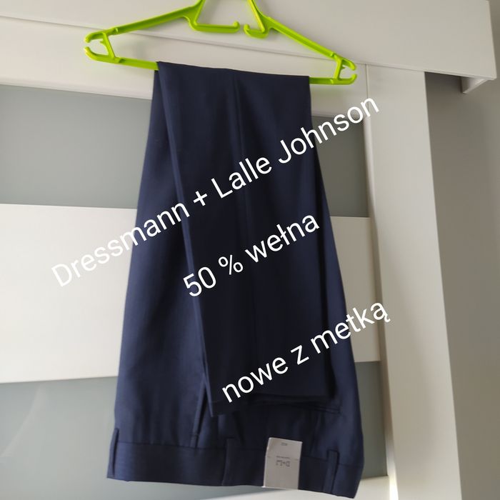 Nowe wizytowe męskie spodnie D+LJ eleganckie W32 wełna granat tanio