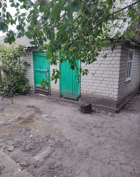 Продам в Харківській  обл, м.Балаклії 1/2 частку часного будинка