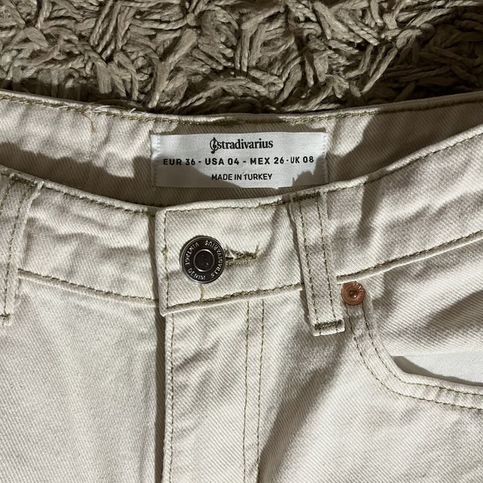 білі кльош джинси з високою посадкою