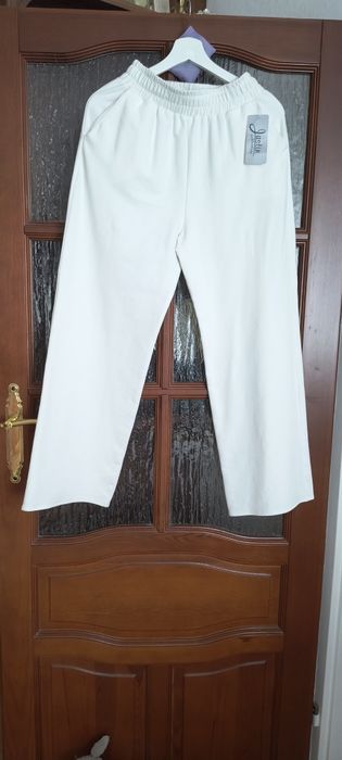 Śmietankowe szerokie spodnie rozm 40