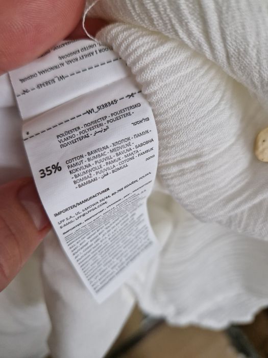 Biała sukienka Sinsay S