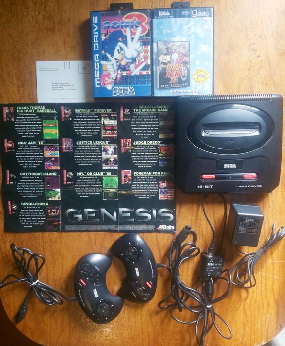 Mega drive ll com jogos pôster e 2 comandos.