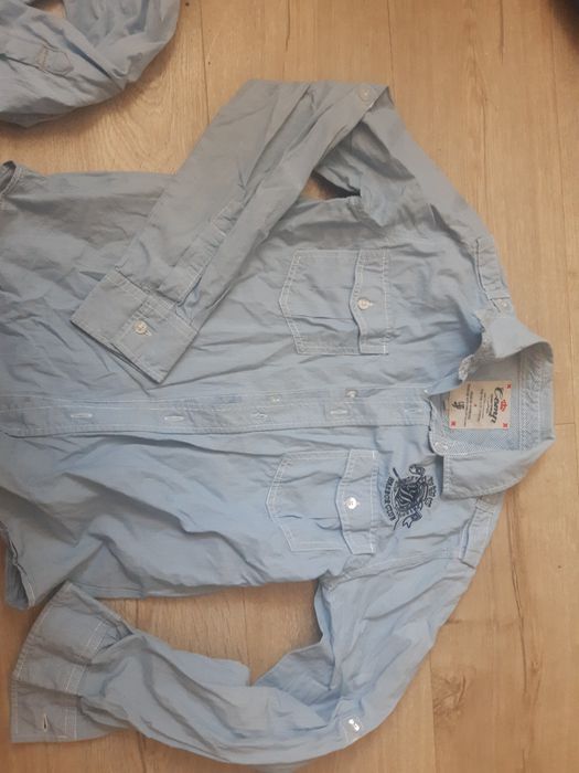 2 koszule błękitne paski 152 oraz 158