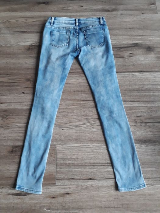 Spodnie jeansowe damskie z niskim stanem z rozdarciami z dziurami r. S