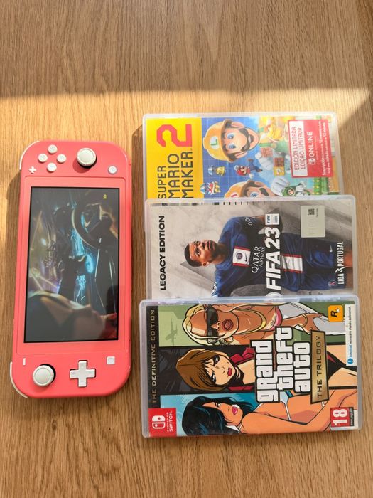 Nintendo Switch Lite + 3  jogos