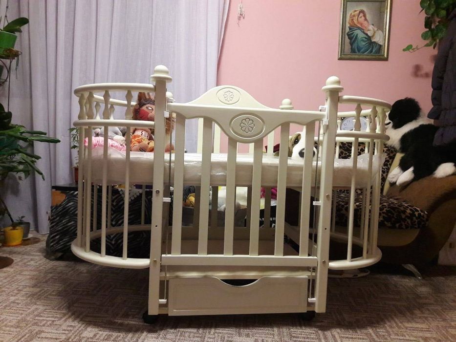 "Кароліна" Дитяче ліжечко-трансформер(кругле/овальне)з ящиком кроватка