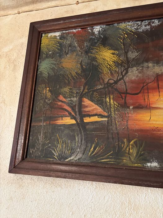 Quadro decorativo com uma pintura de uma paisagem tropical ao pôr do sol, semelhante a obras de arte de ilhas tropicais com palmeiras e barcos