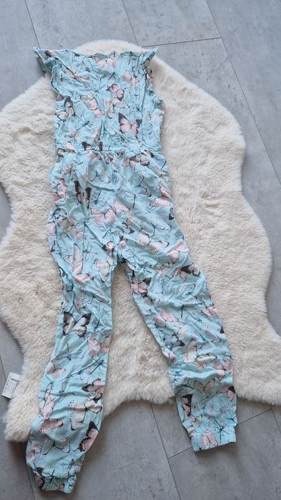 Kombinezon dziewczęcy w motyle 122/128