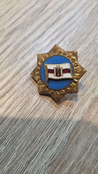 Złota odznaka „Zasłużony Pracownik PLO