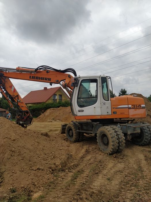 Usługi koparkoładowarką, koparka obrotową, minikoparką, przyłącza wod-