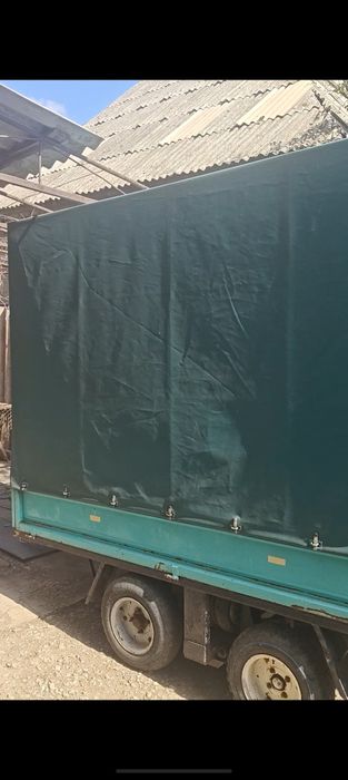 Прицеп двухосный тентованый