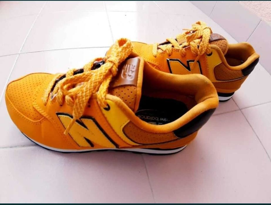 Ténis NB amarelo