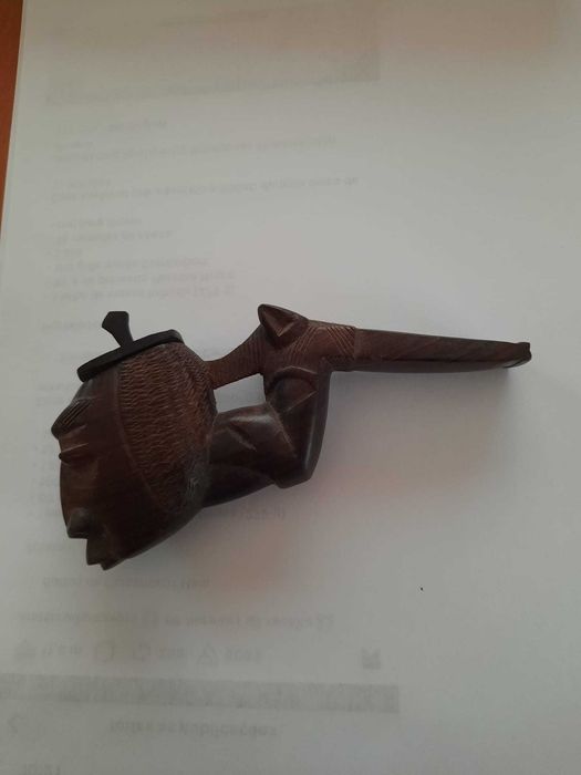 Wood-carved pipe, African art.