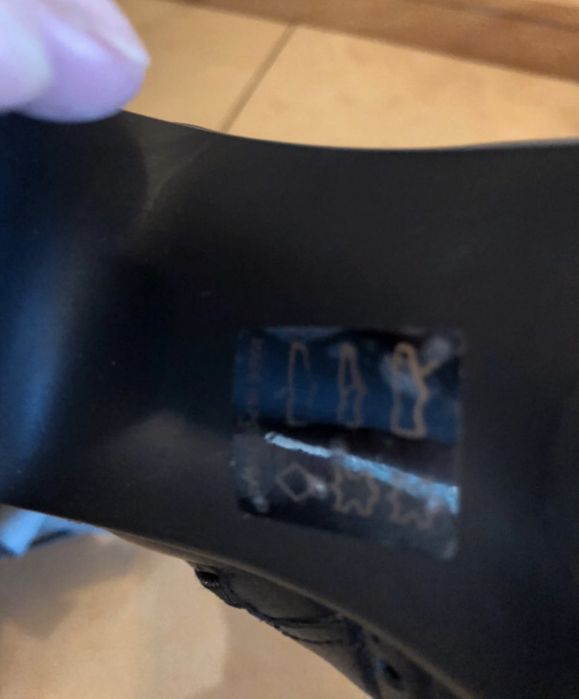 Botas em pele de camp alto da marca EXé