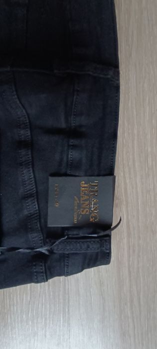 Nowe spodnie czarne z perełkami i z kokardką Trang jeans r. L