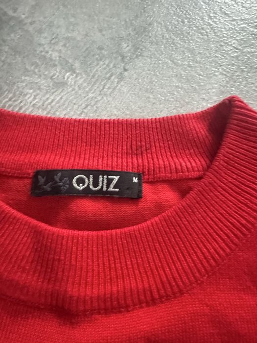 Sweter czerwony z falbanka