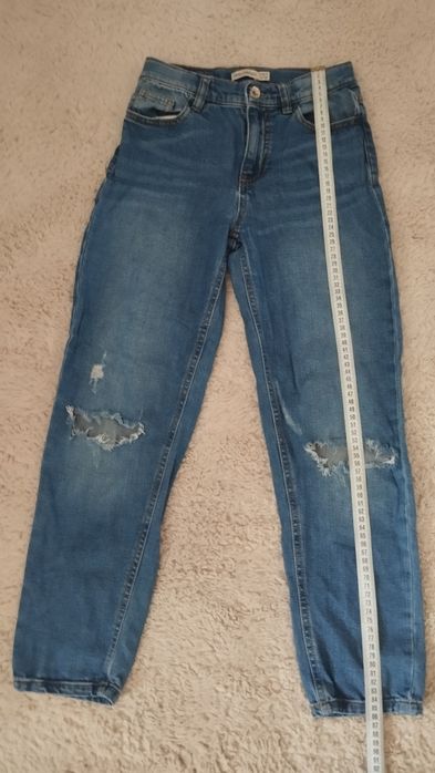 Spodnie jeans z dziurami