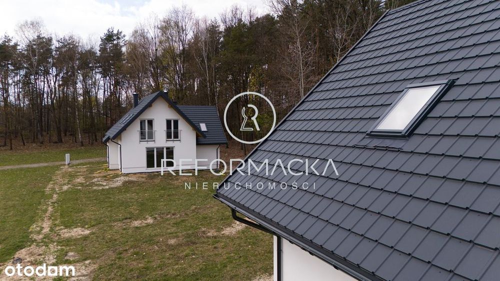 Dom w stanie deweloperskim pod lasem.