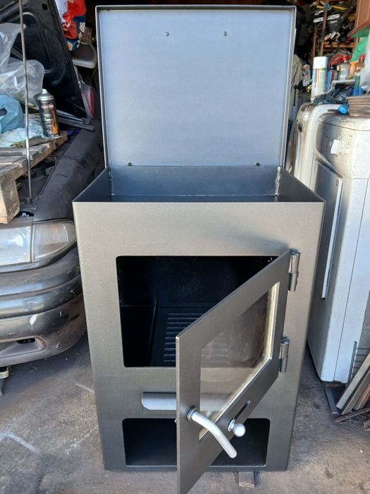 Vendo salamandra a lenha com tampo que abre para cozinhar.  Como nova.