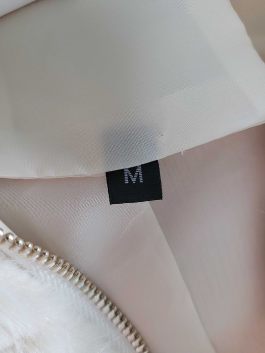 Casaco de pelo sintético com carapuço