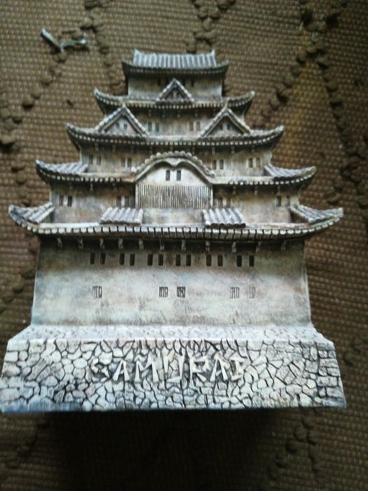 Chinese-themed backdrop with figurines included