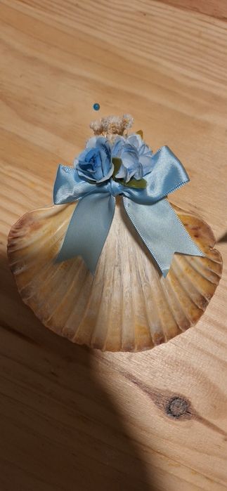 Conchas e velas de batizado