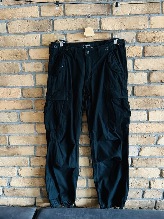 Damskie czarne spodnie taktyczne bojówki z kieszeniami rozmiar 31