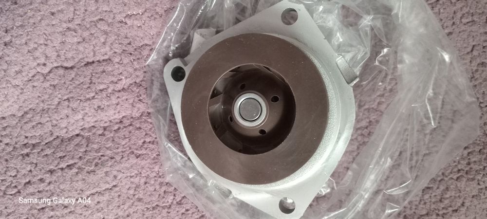 Продам комплект ремень грм з натяжним роликом ,та помпу