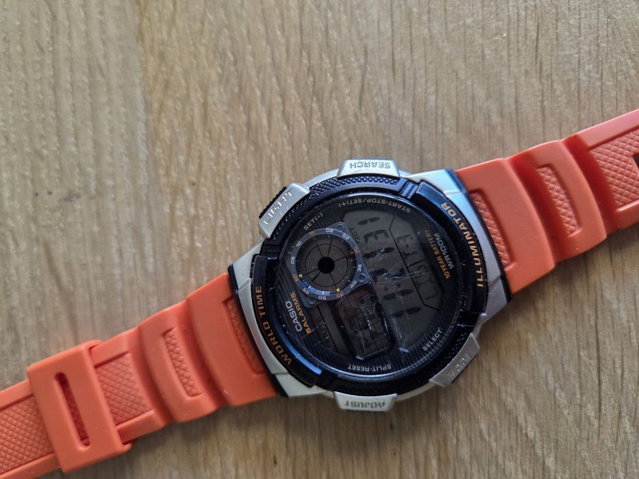 Relógio Casio AE-1000W World Time (Bracelete Laranja)