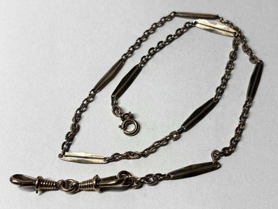 Antigas correntes de relógios de bolso em metal dourado