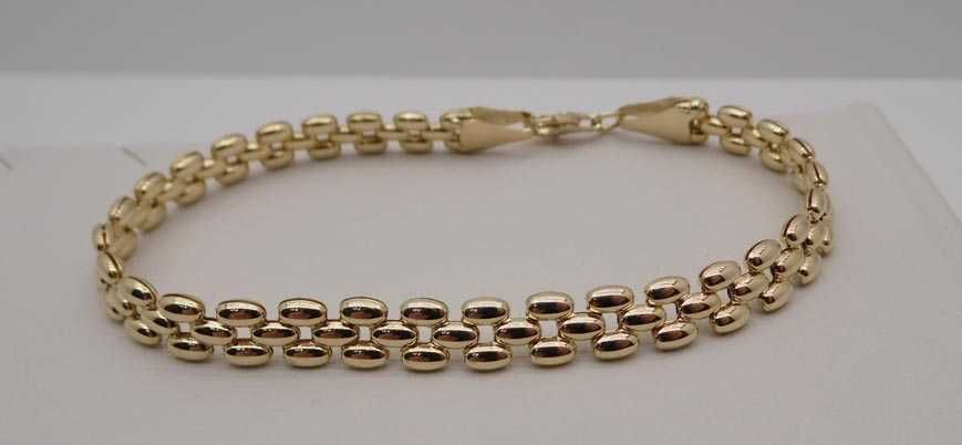 Złota bransoletka pękate ozdoby 19 cm. 6,4 mm.