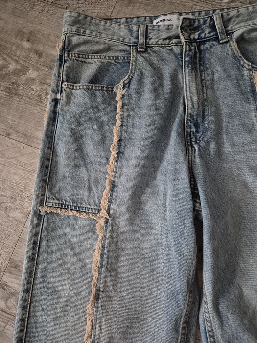 Luźne spodnie jeansy baggy Bershka M