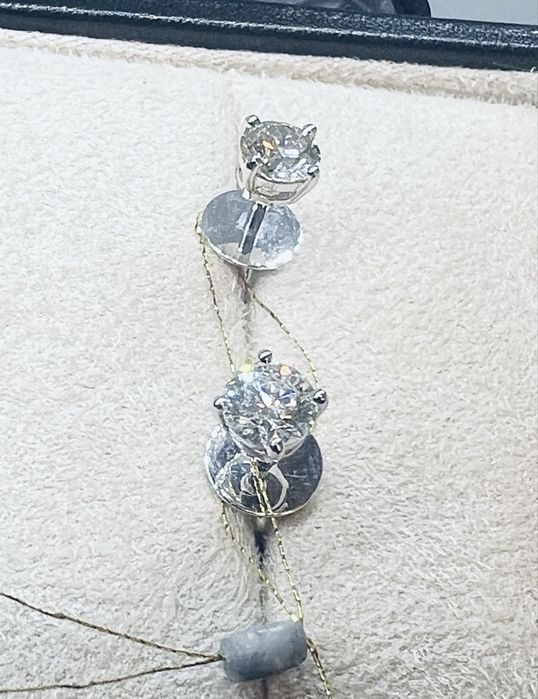 Золоті сережки на закрутках з діамантами 1.08 карат. Брилианты полукар