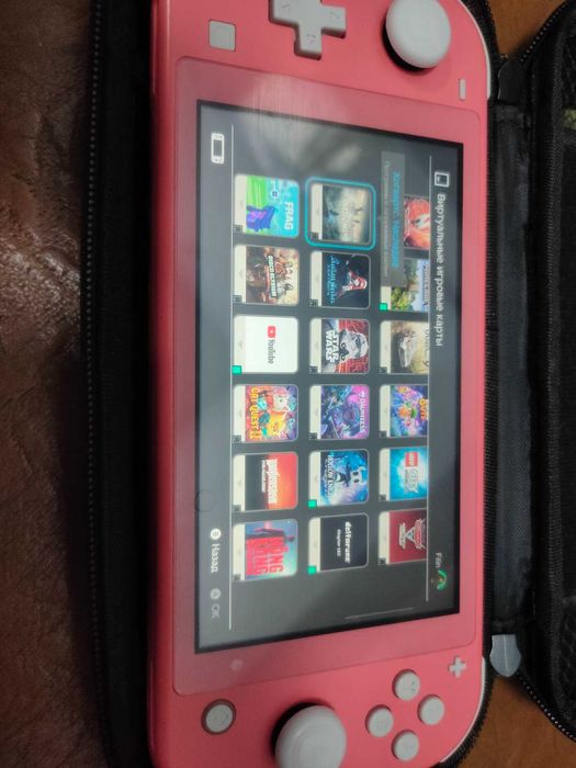 Nintendo Switch Lite та купа ігор плюс геймпад