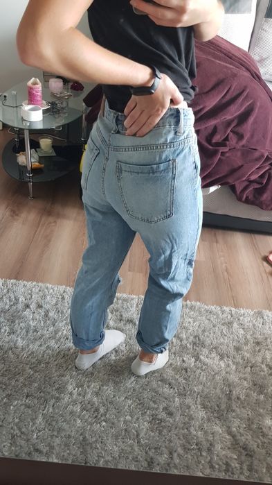 Spodnie jeans z "podarciami"