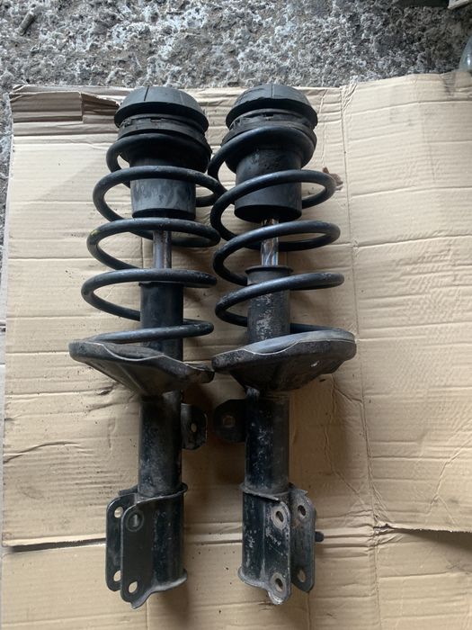 Передние стойки амортизаторы Шевроле Авео заз вида опоры пружины СТО