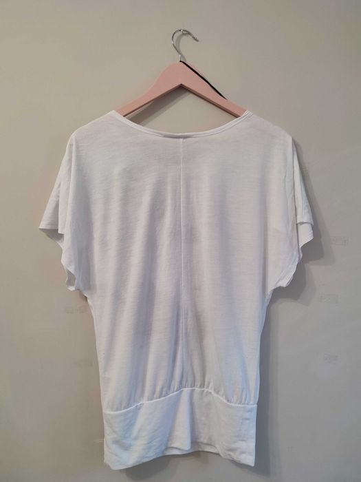 Bluzka nietoperz z twarzą kobiety