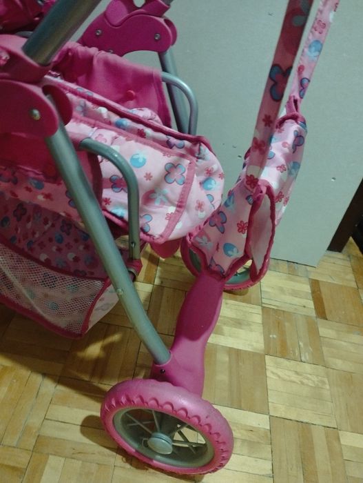 Różowy wózek dla lalek