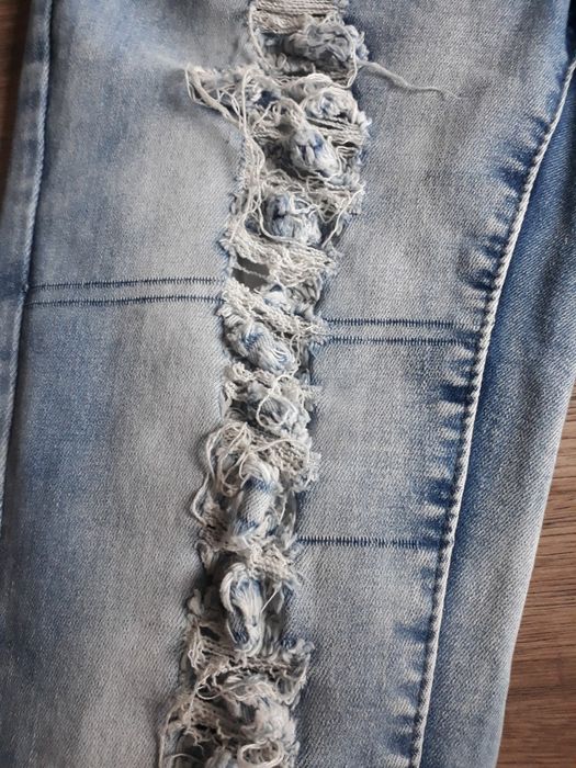 Spodnie jeansowe damskie z niskim stanem z rozdarciami z dziurami r. S