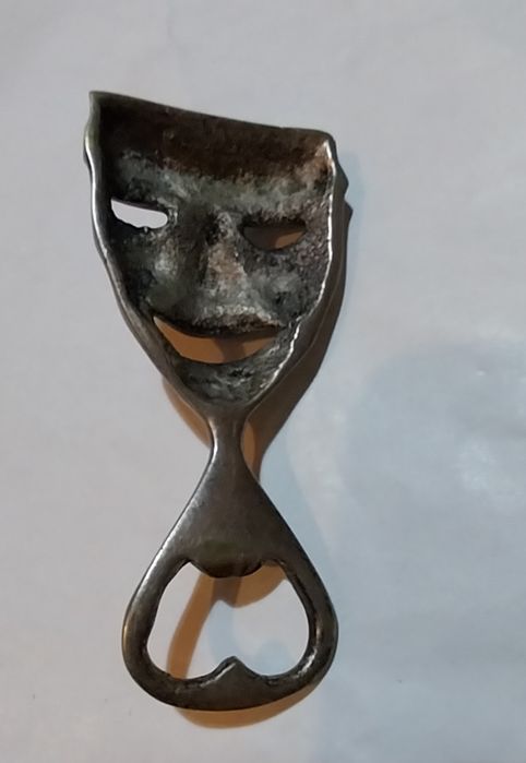 Abre cápsulas antigo em metal