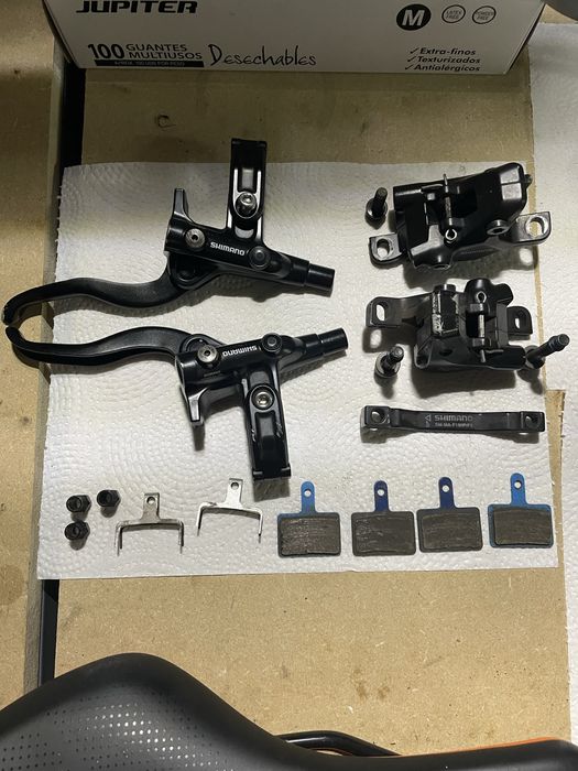 Manetes, pinças e calços Shimano