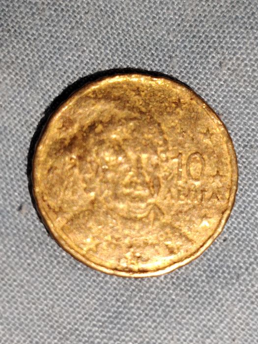 Moeda com erro Excesso de metal; data não visível