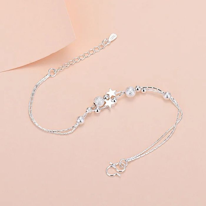 Pulseira/tornozeleira prateada com estrelas e bolinhas