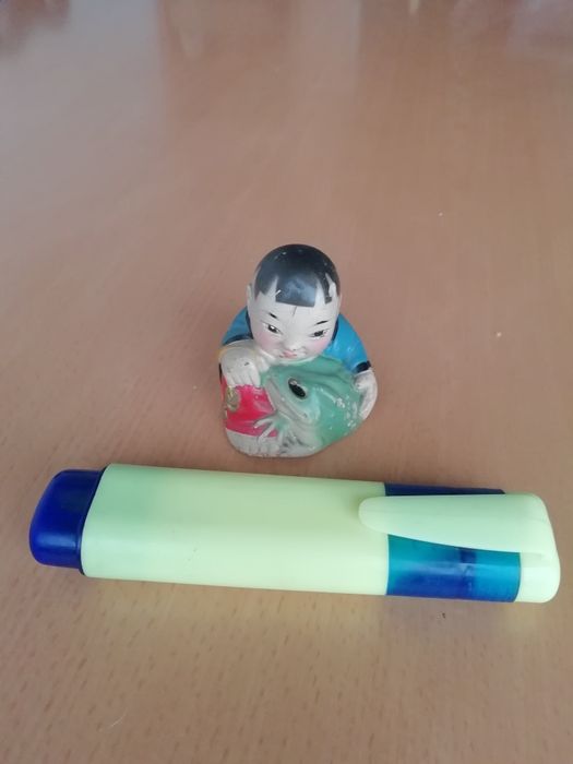 Conjunto de Budas em loiça.