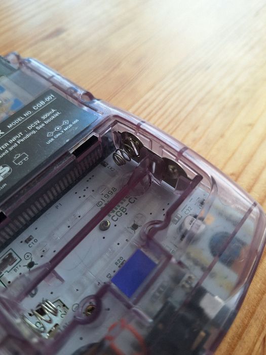 Gameboy roxo e jogo Harry Potter