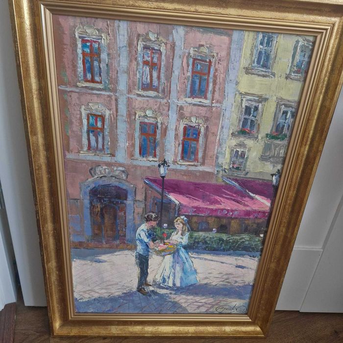 obraz ręcznie malowany, para na tle kamieniczek w ramie
